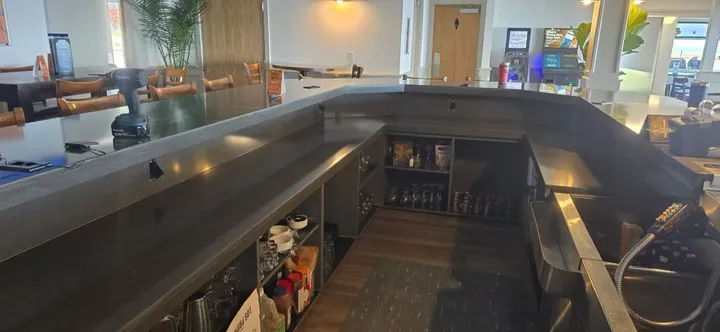 Dark stone bar counters in a commercial installation