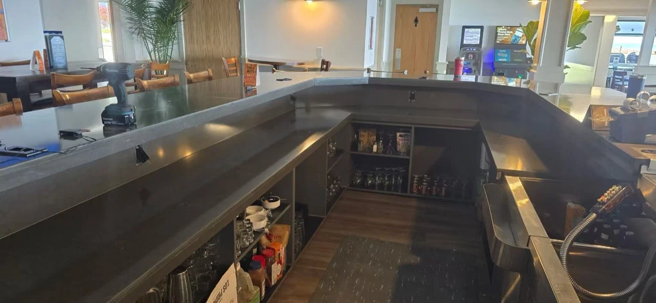 Dark stone bar counters in a commercial installation