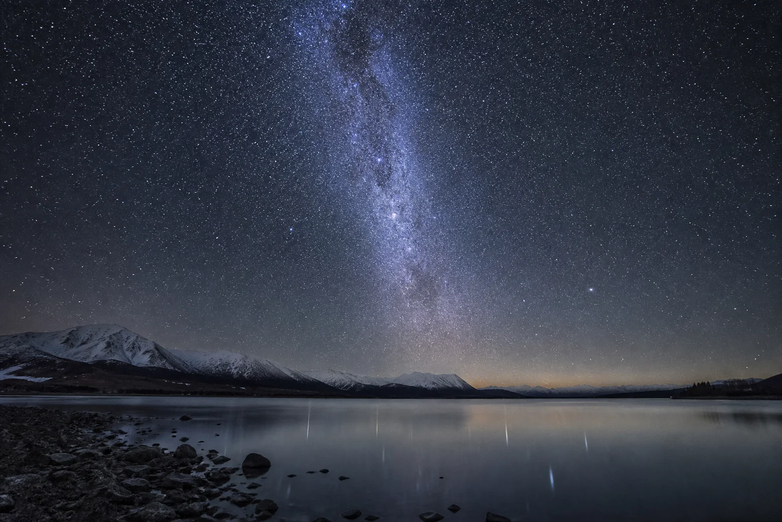The Milky Way above a mountain lake near Lake Tekapo